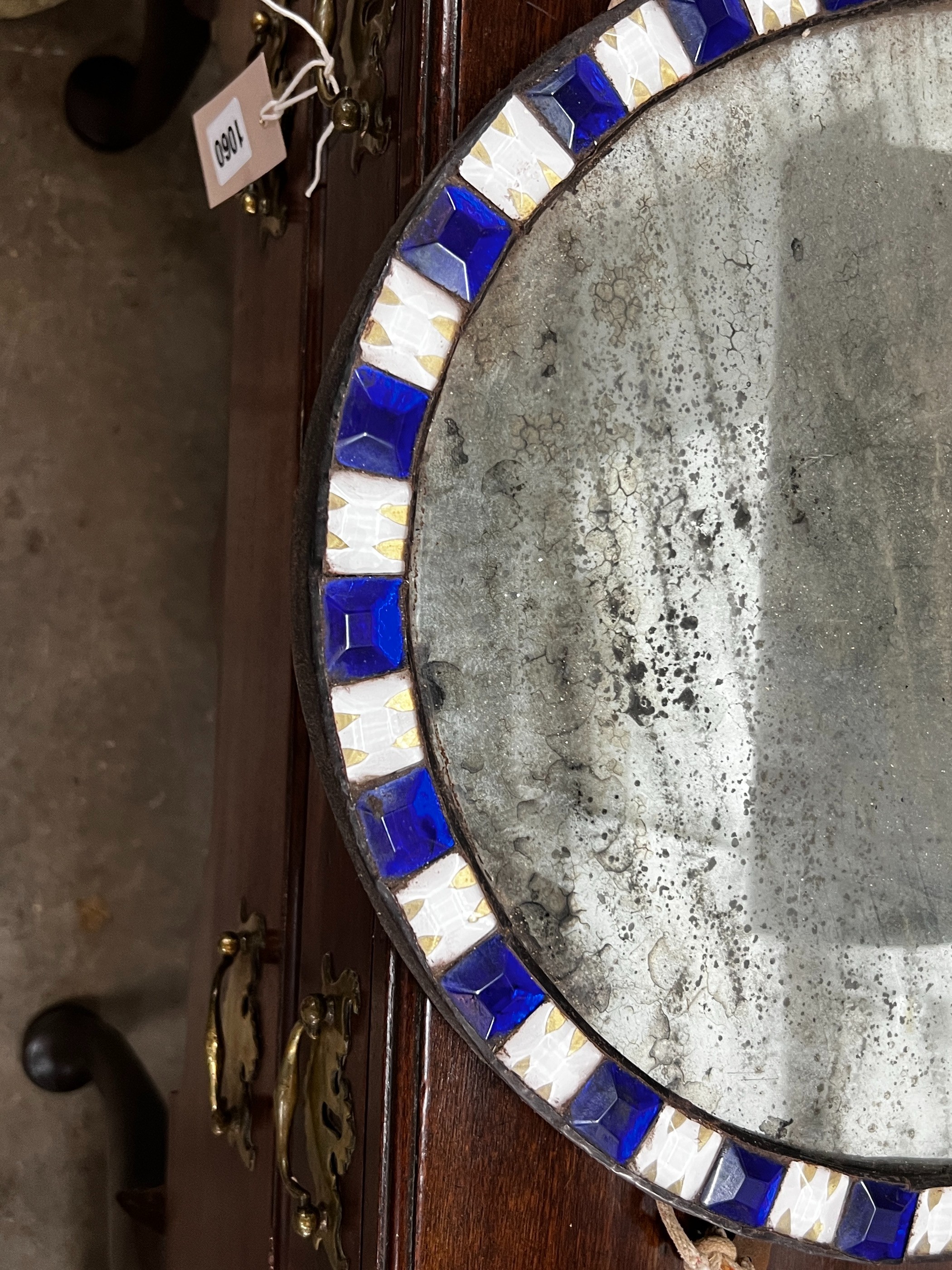 An oval Irish style wall mirror, width 41cm, height 51cm